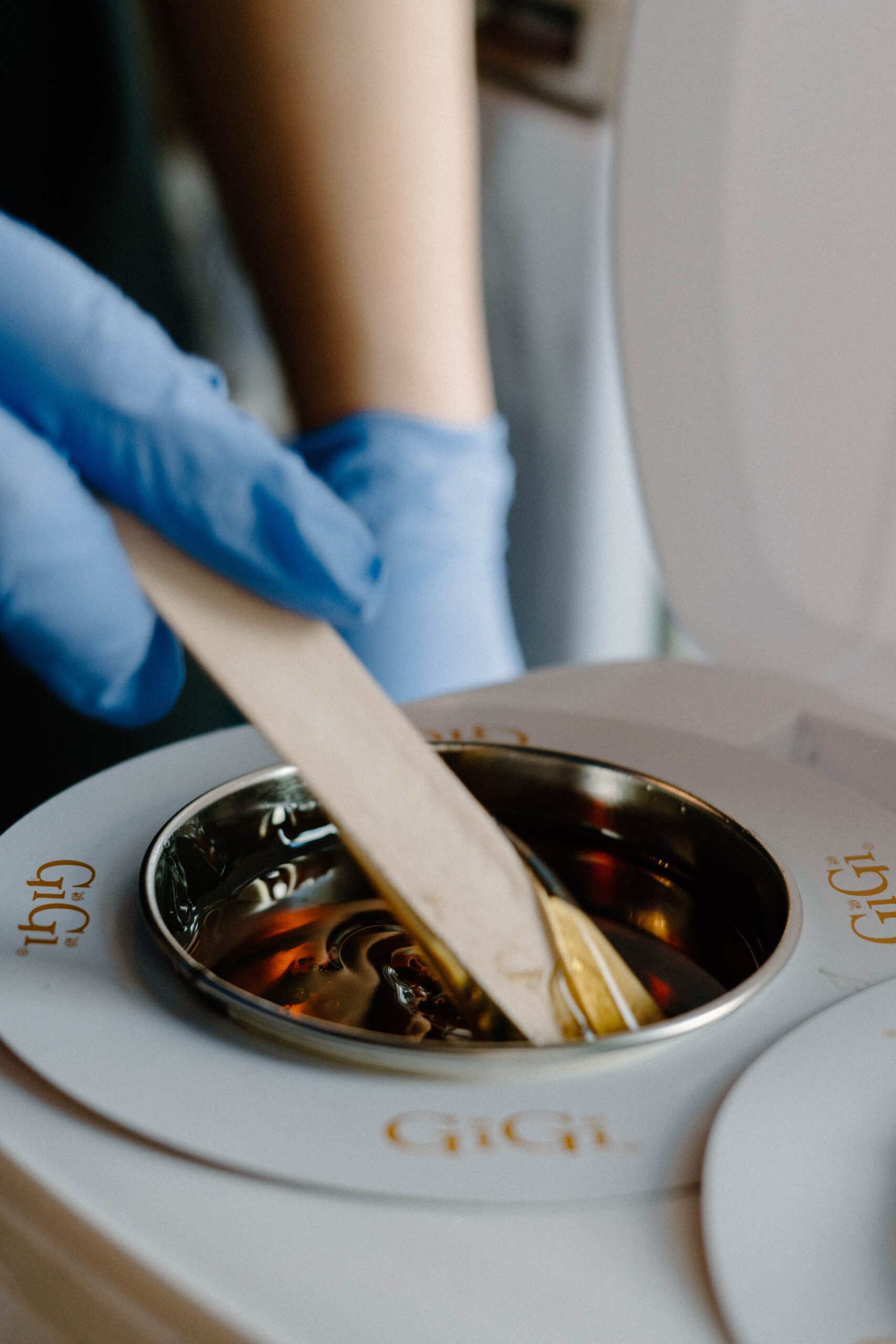 Aesthetician using a waxing pot from Aesthetically Speaking in Reno, Nevada.