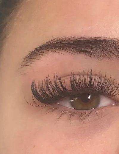 Zoomed photo of an eye showing eyelash extensions example 17 from Aesthetically Speaking in Reno, Nevada.