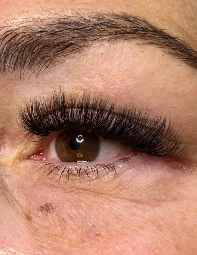 Zoomed photo of an eye showing eyelash extensions example 11 from Aesthetically Speaking in Reno, Nevada.