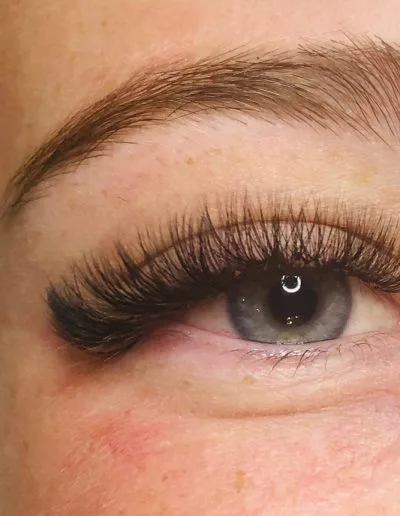 Zoomed photo of an eye showing eyelash extensions example 10 from Aesthetically Speaking in Reno, Nevada.