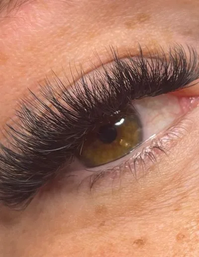 Zoomed photo of an eye showing eyelash extensions example 8 from Aesthetically Speaking in Reno, Nevada.