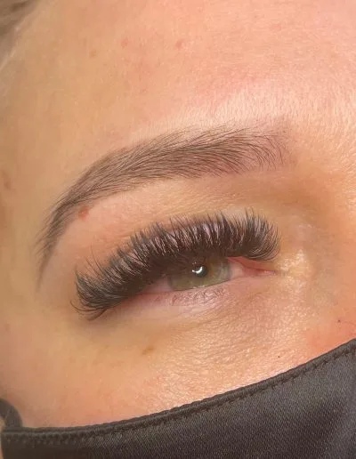 Zoomed photo of an eye showing eyelash extensions example 6 from Aesthetically Speaking in Reno, Nevada.