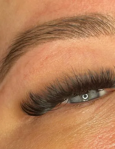 Zoomed photo of an eye showing eyelash extensions example 5 from Aesthetically Speaking in Reno, Nevada.