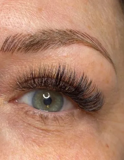 Zoomed photo of an eye showing eyelash extensions example 15 from Aesthetically Speaking in Reno, Nevada.