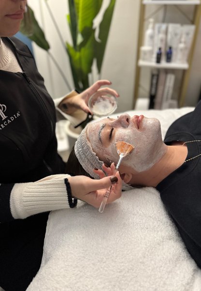 Giving facial to a client using image skin care - Aesthetically Speaking, Reno Giving facial to a client using image skin care - Aesthetically Speaking, Reno